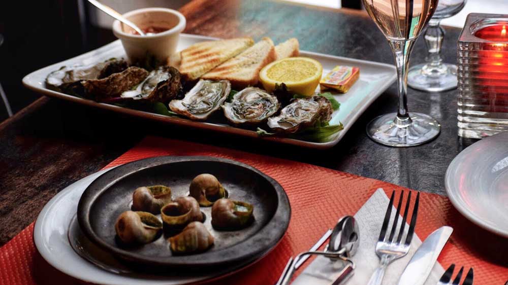 a-french-dinner-with-oysters-snails-and-wine-rose-Top-Michelin-Starred-Restaurants-in-Paris-for-Foodies